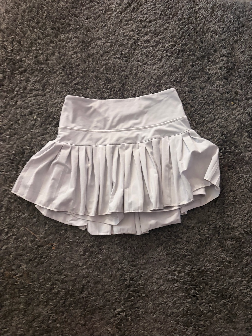 Women's White Pleated Mini Skirt with Flared Ruffle Hem